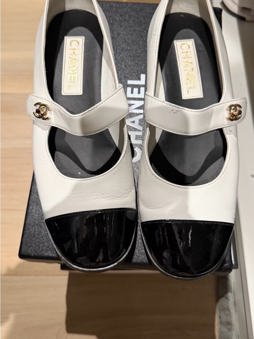 CHANEL White Leather Mary Jane Flats with Black Patent Cap Toe and Gold CC